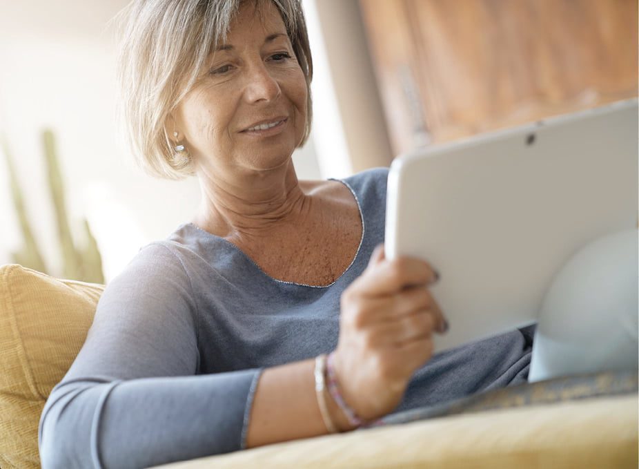 Lady browsing a tablet